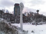 A lamppost by the falls encrusted in ice